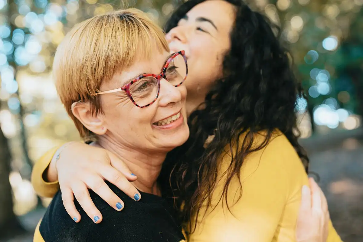 a mother and daughter hugging each other during family therapy at a drug and alcohol rehab center in riverside california