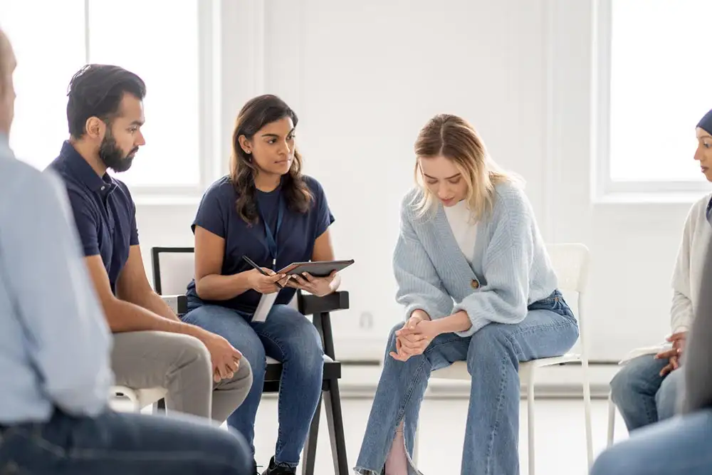 People gathered in a circle during fentanyl addiction treatment