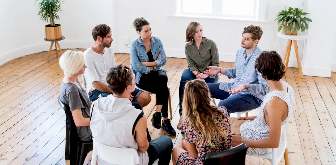 People in circle during a group theray from a drug rehab center in Los Angeles California