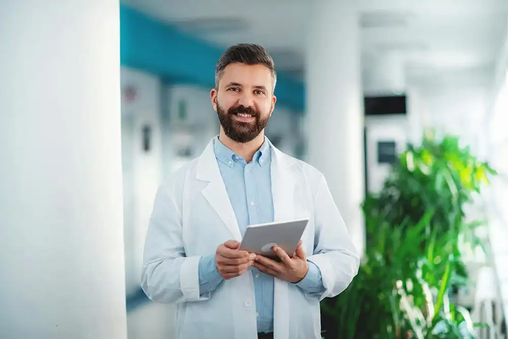 a doctor holding an ipad Basic Detoxification