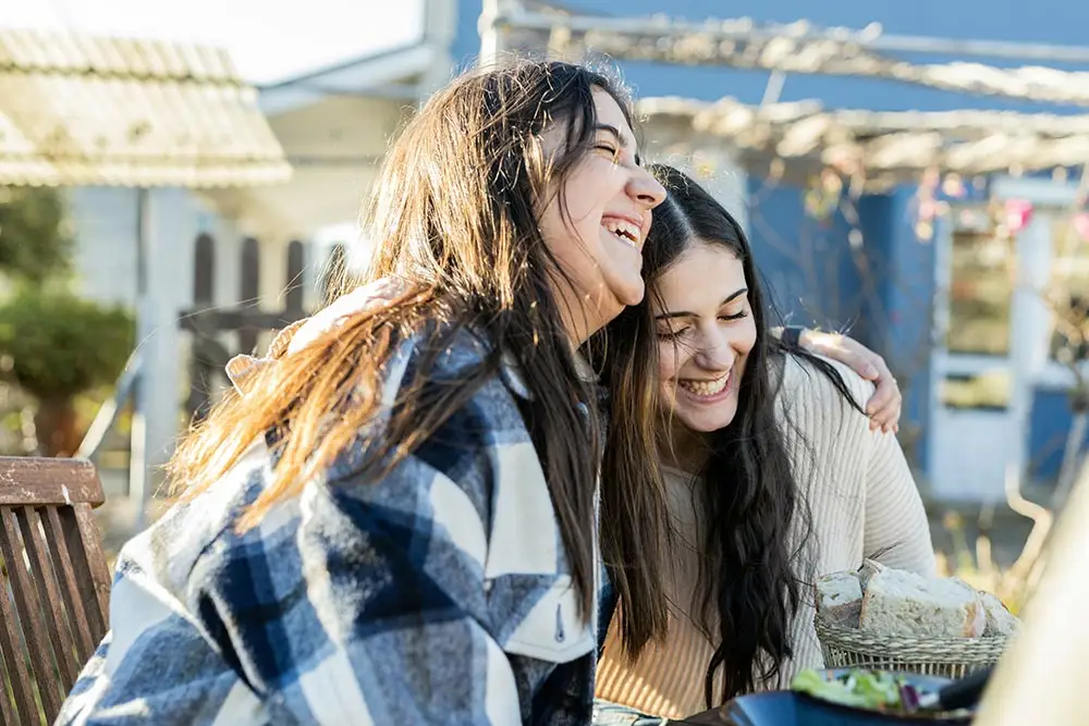 two friends enjoying each other's company in a drug rehab center in riverside california