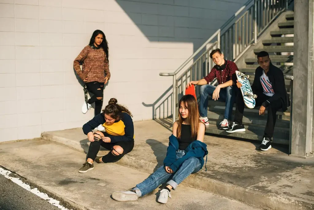 youth and young adults posing for camera outdoor
