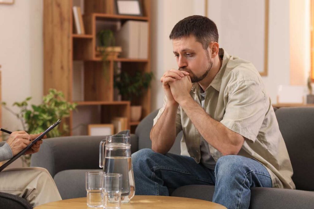 a man during psychotherapy at addiction treatment center