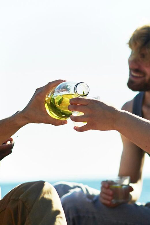 friends drinking near the beach