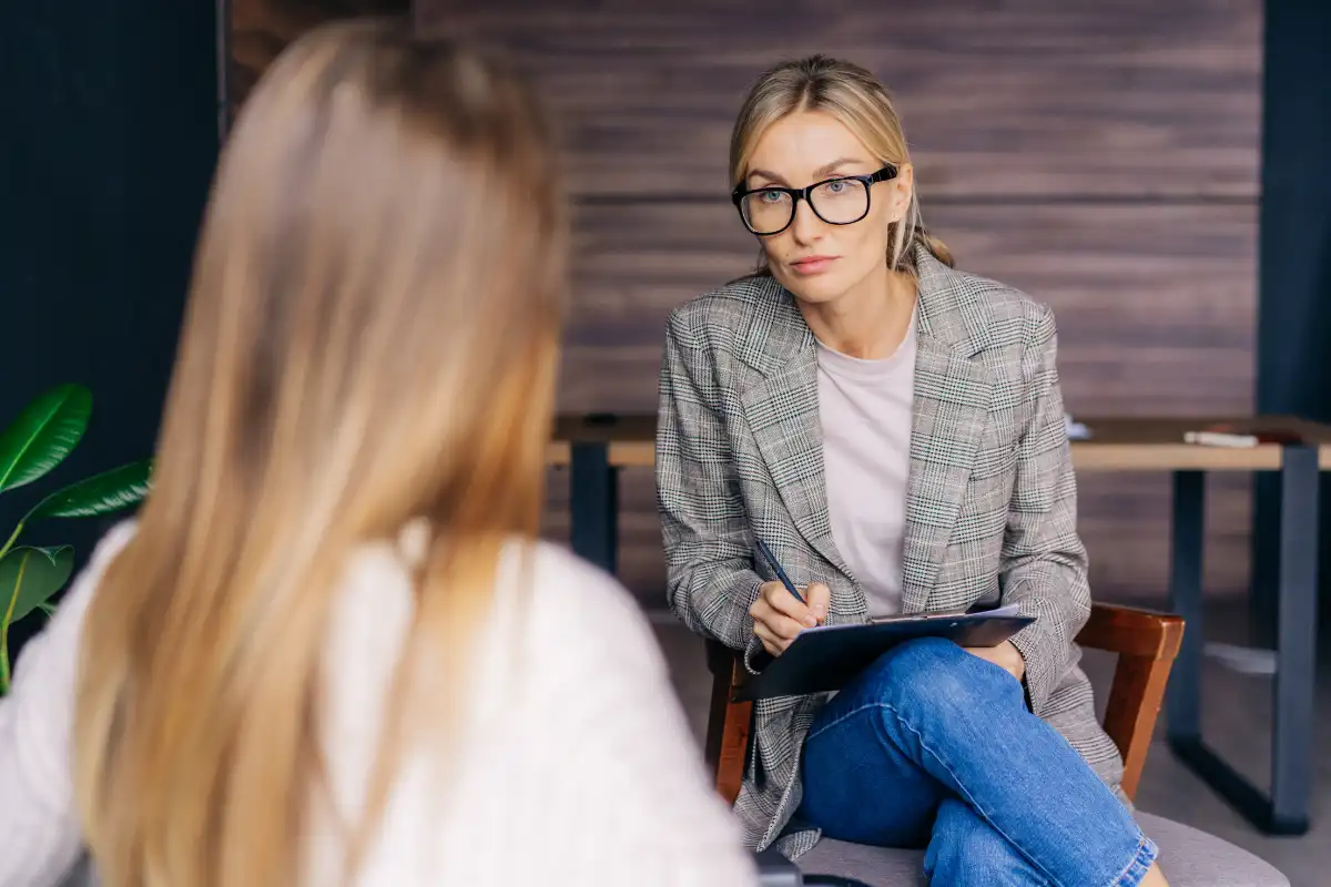 female client with an admission staff durin initial assessment at a drug and alcohol rehab in riverside california