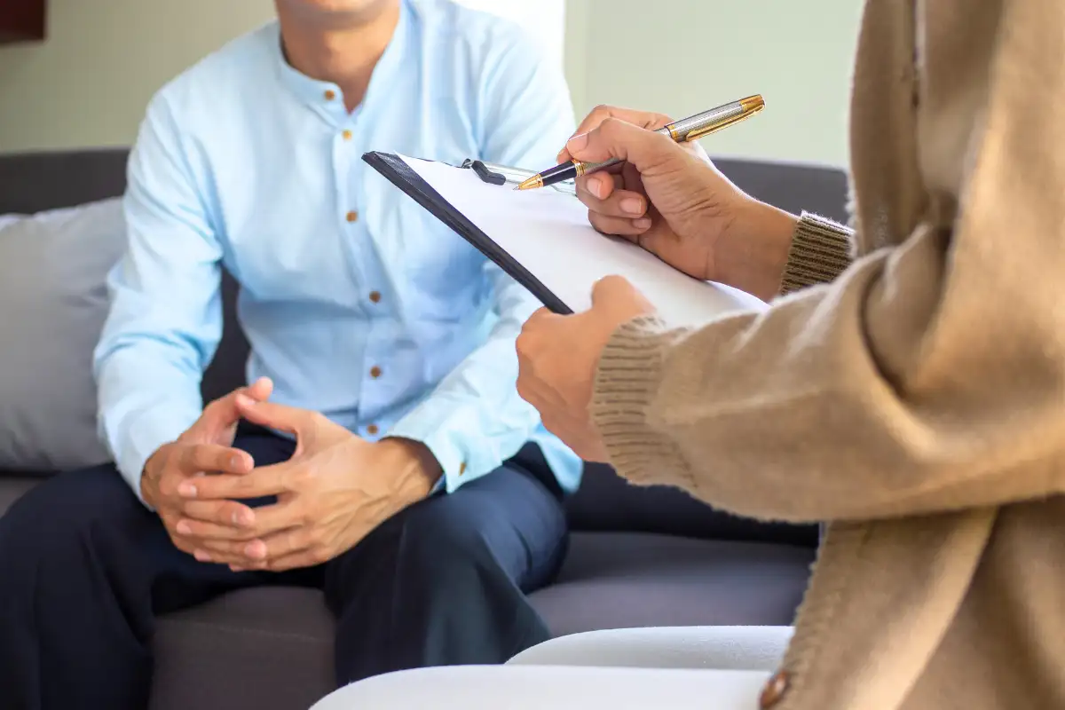 a male client and counselor during one on one therapy