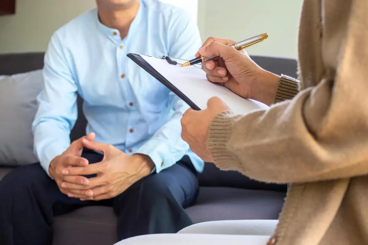 a man and a female psychologist during a psychotherapy