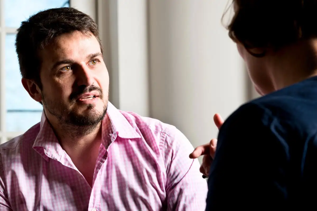 a man and a female psychologist during counselling session
