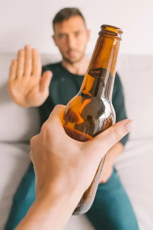 man refusing alcohol