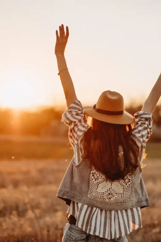 Peaceful woman having fun in meadow