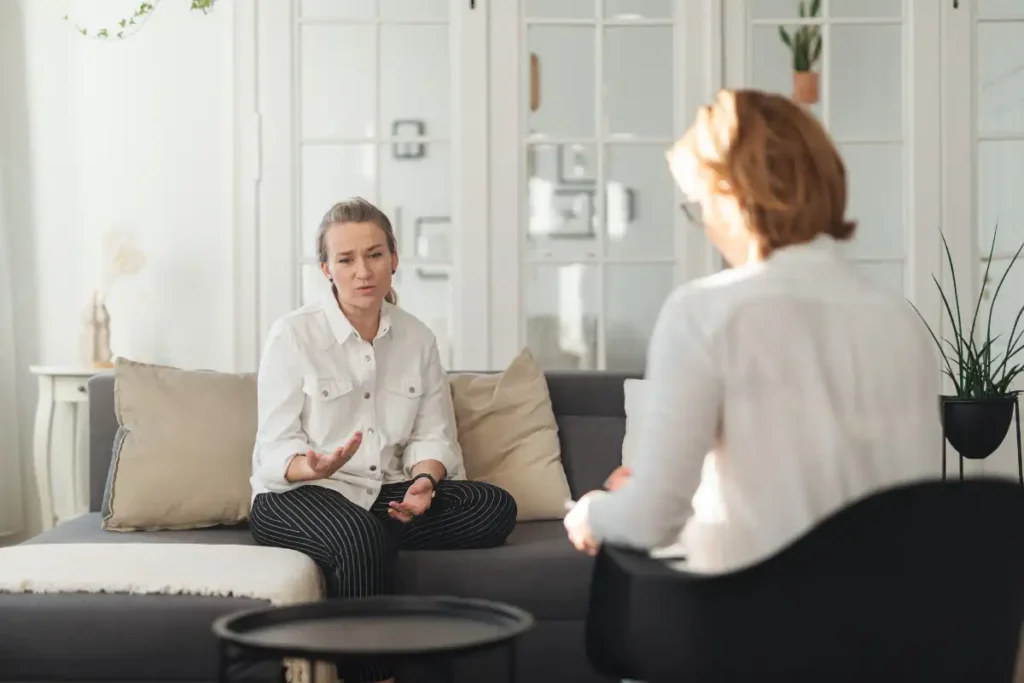 a woman during one on one therapry or individual therapy at an addiction treatment center