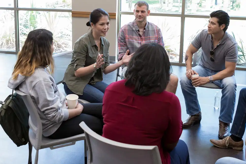 addiction treatment team discussing relapse prevention team