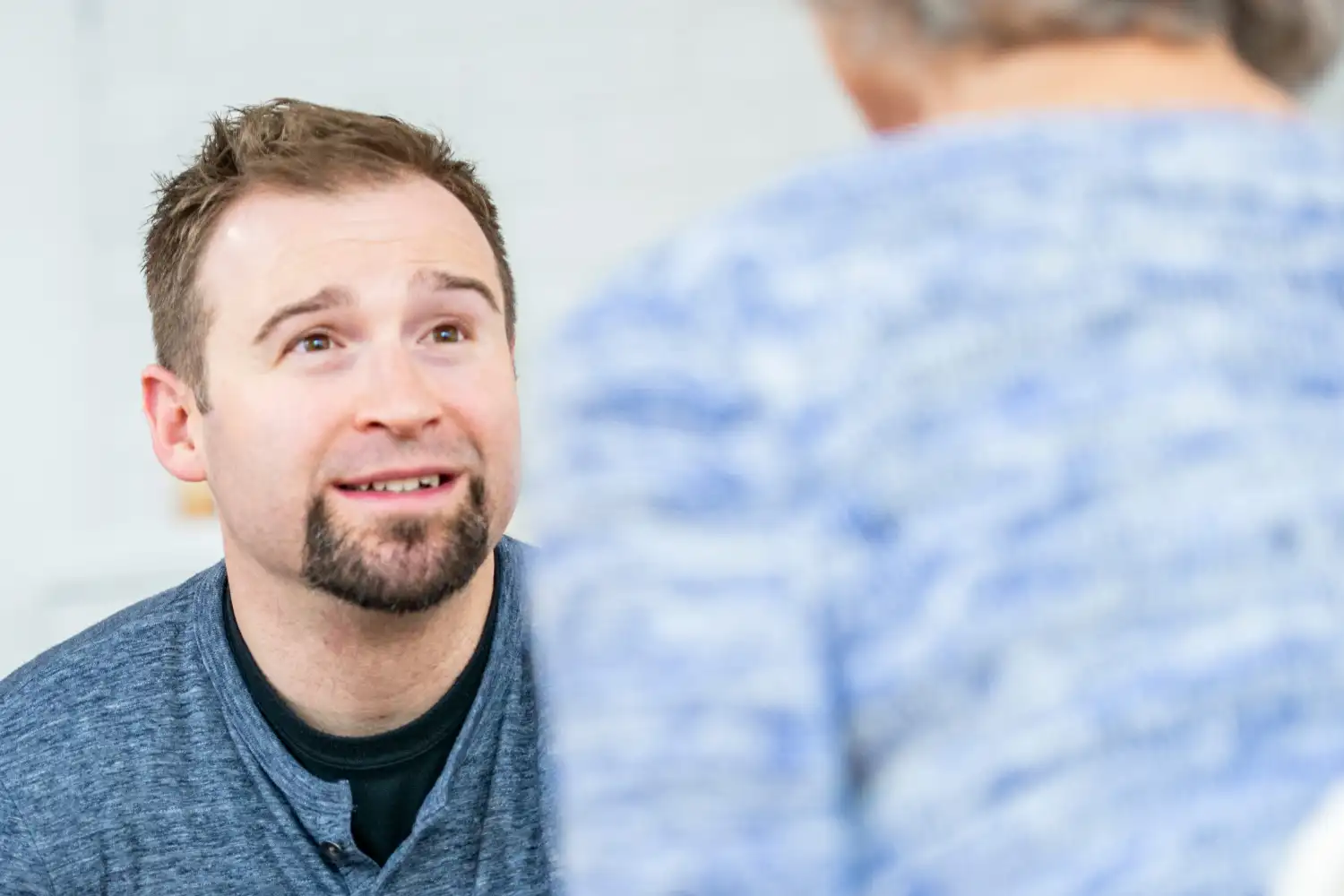 man and a psychologist during individual therapy