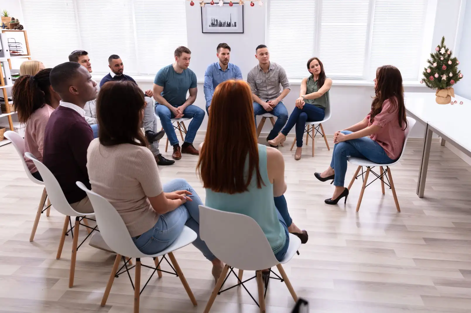 People listening in group therapy session