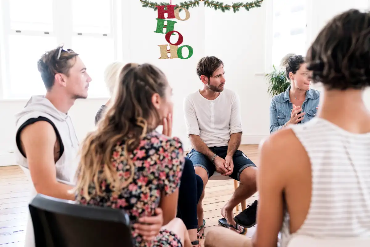 People listening in group therapy session