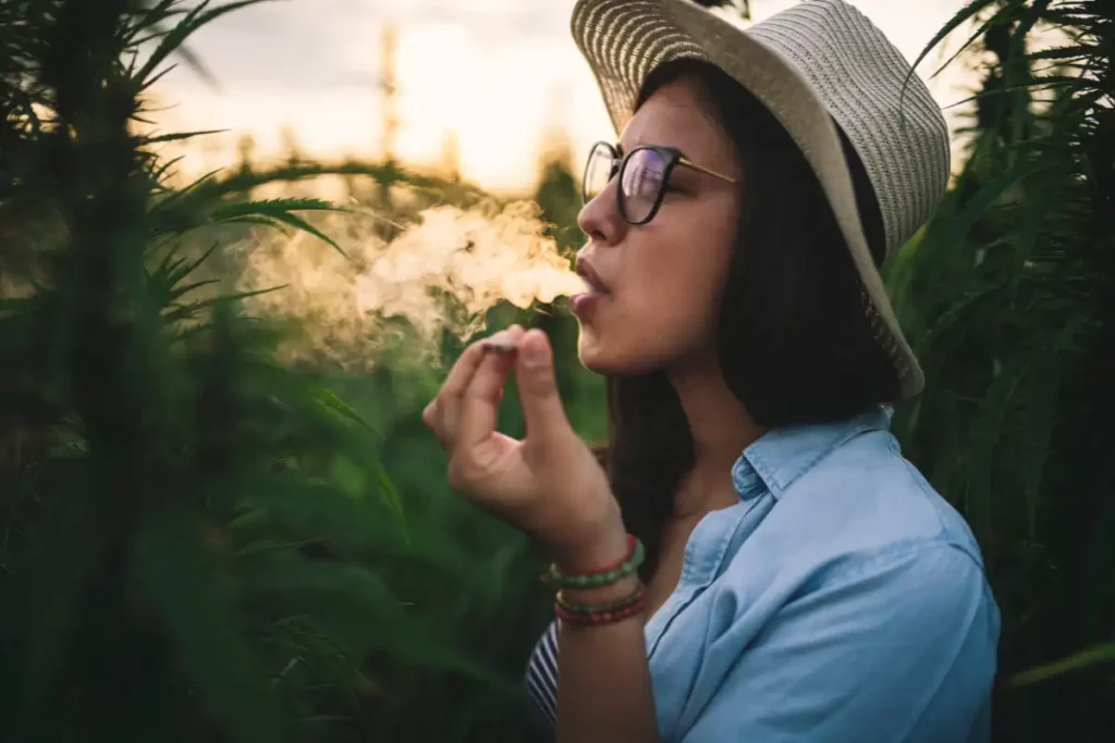Beautiful Woman Smoking Marijuana In Plantation