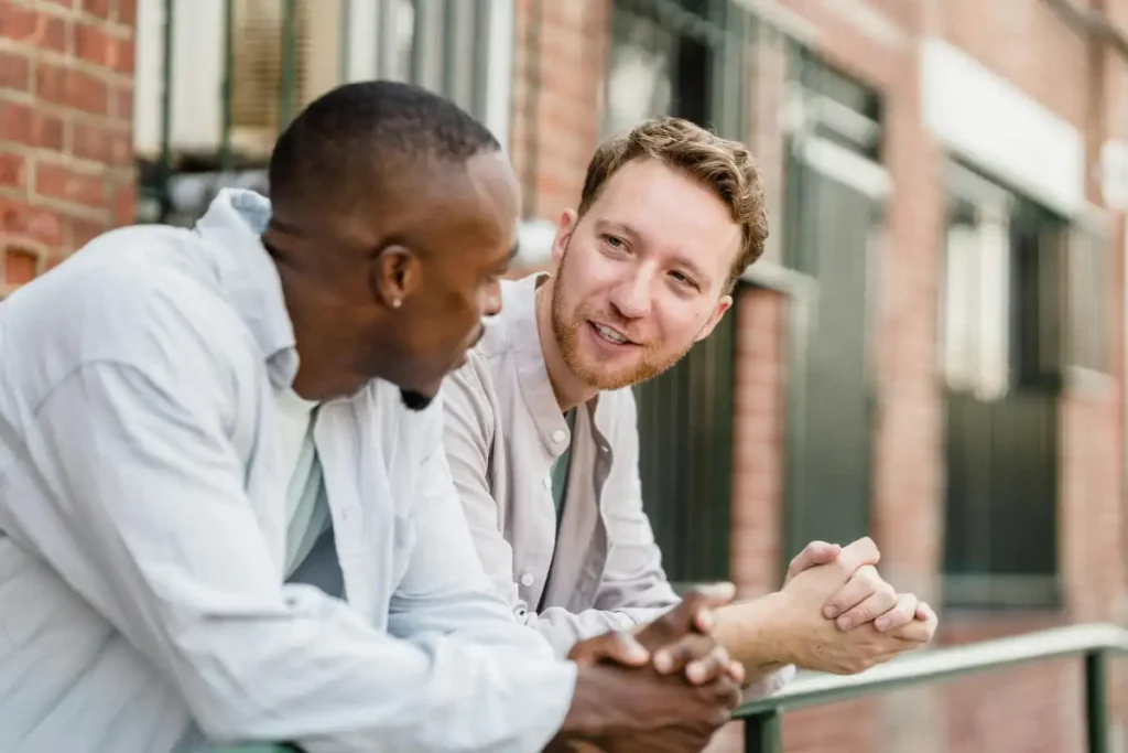 Close-up of Two Men Talking