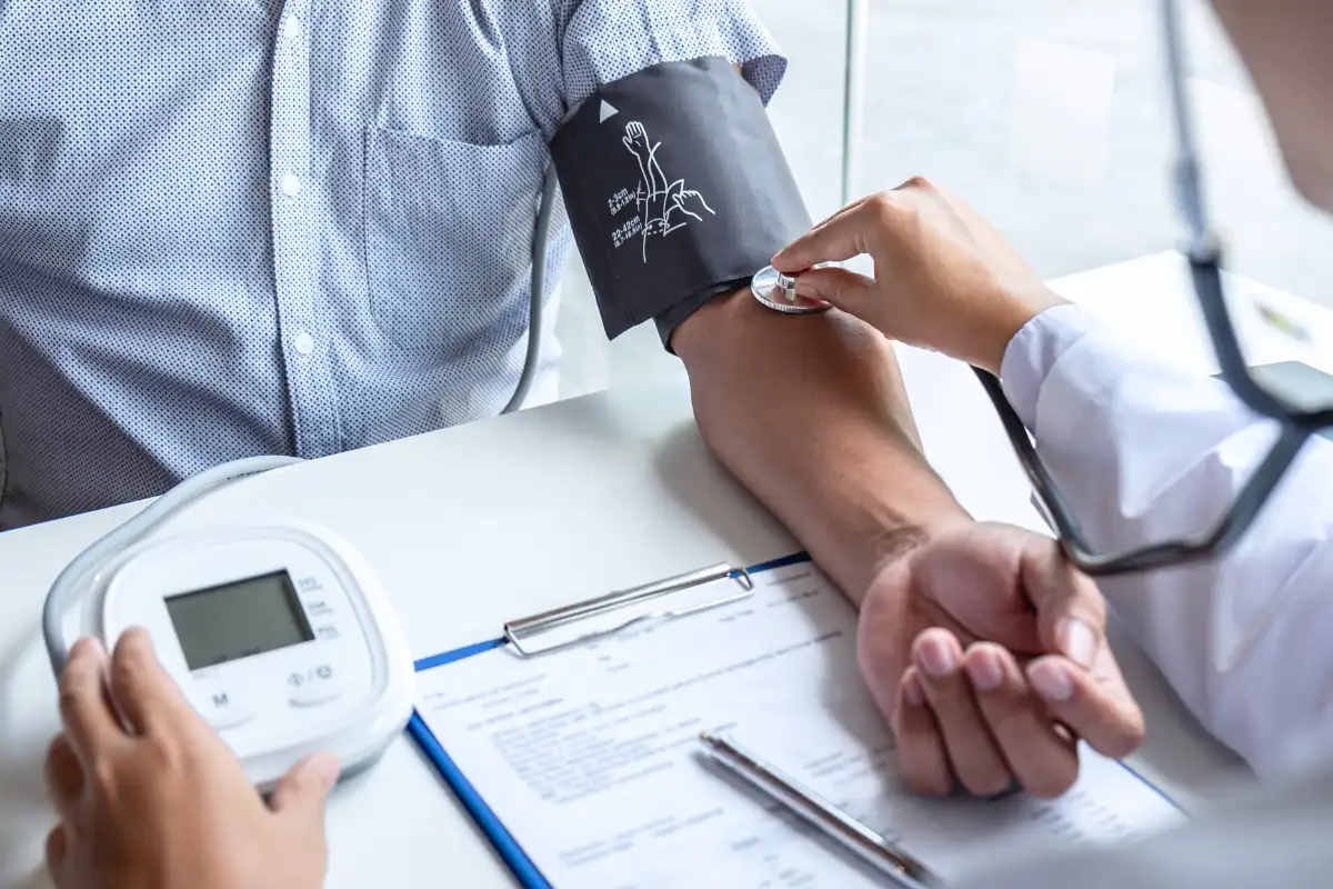 Doctor Checking Patient's Blood Pressure
