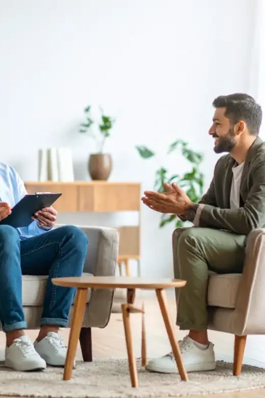 Therapist Consulting with Patient in Office