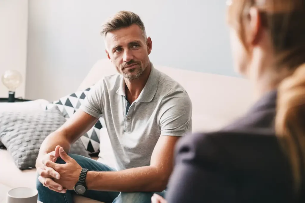 man during one one one counseling together with his psychotherapist