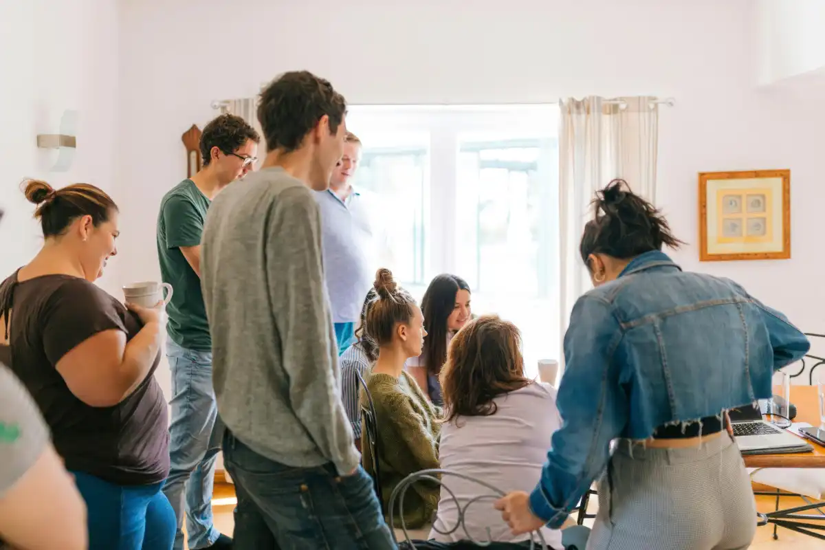 Group of men and women gathering Indoors