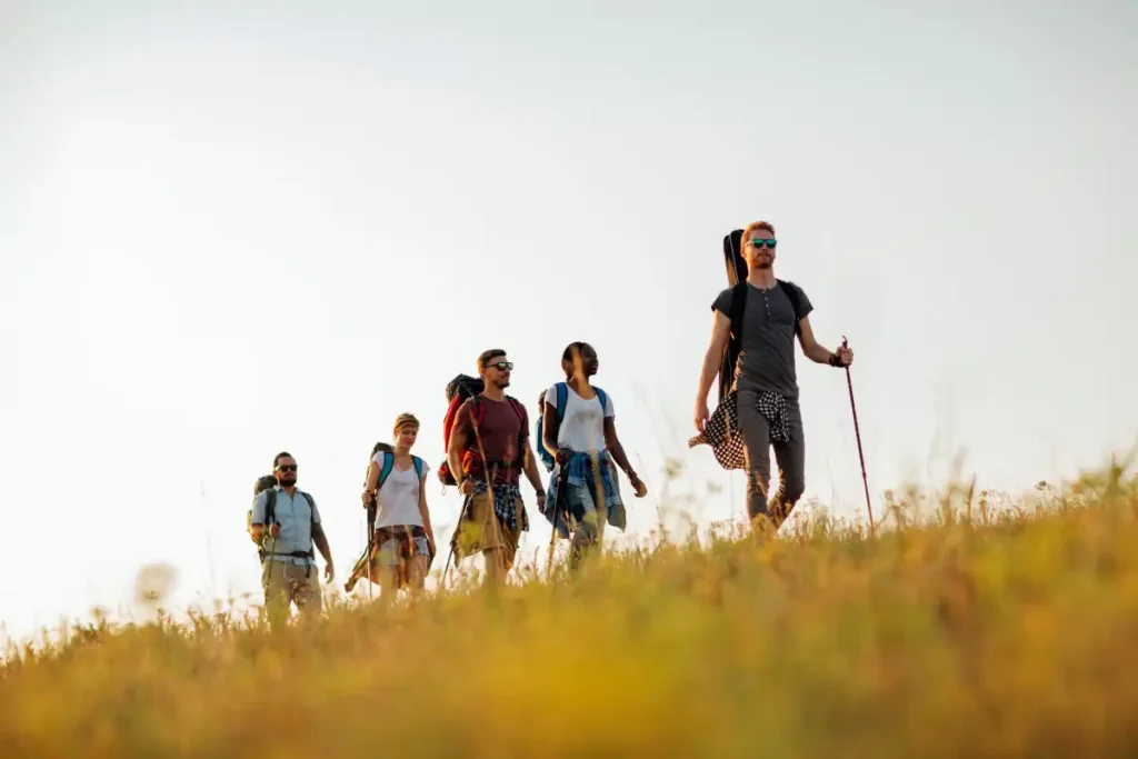 Multiethnic young adults people hiking together