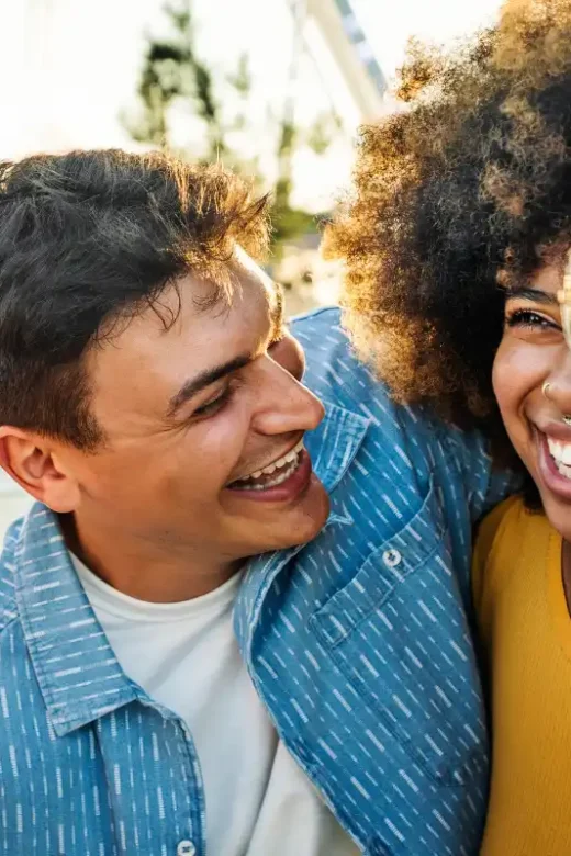 Multiethnic young people laughing together outside - Friendship
