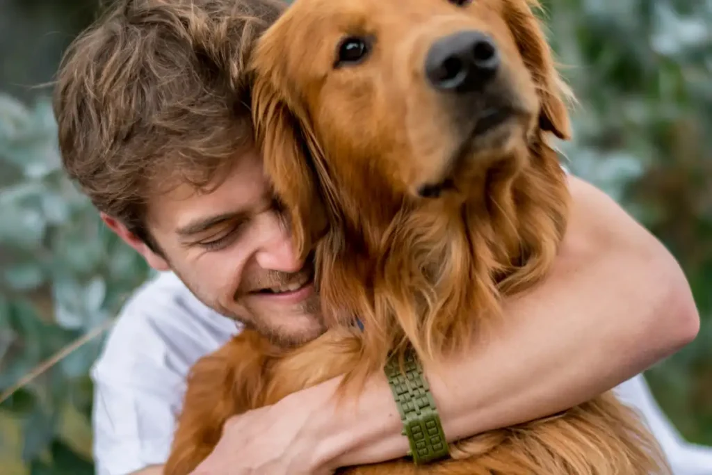 Loving man hugging his dog