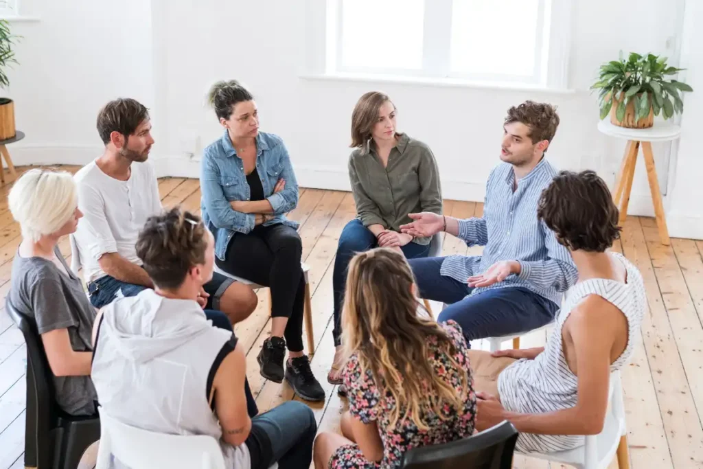 Man talking in group therapy session
