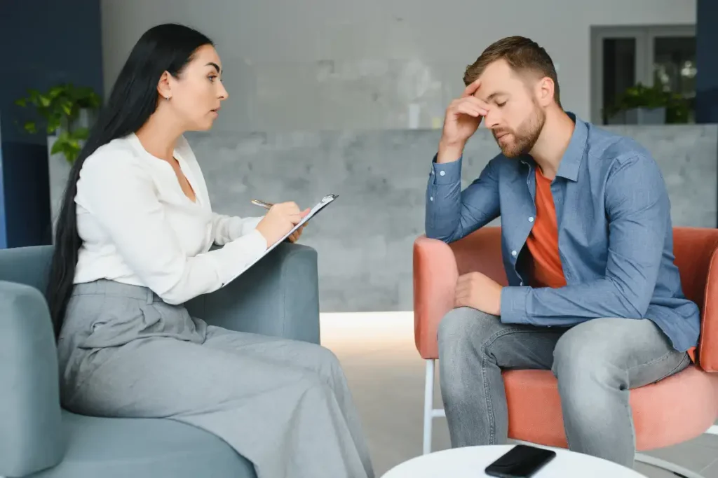 Psychologist talking with patient on therapy session