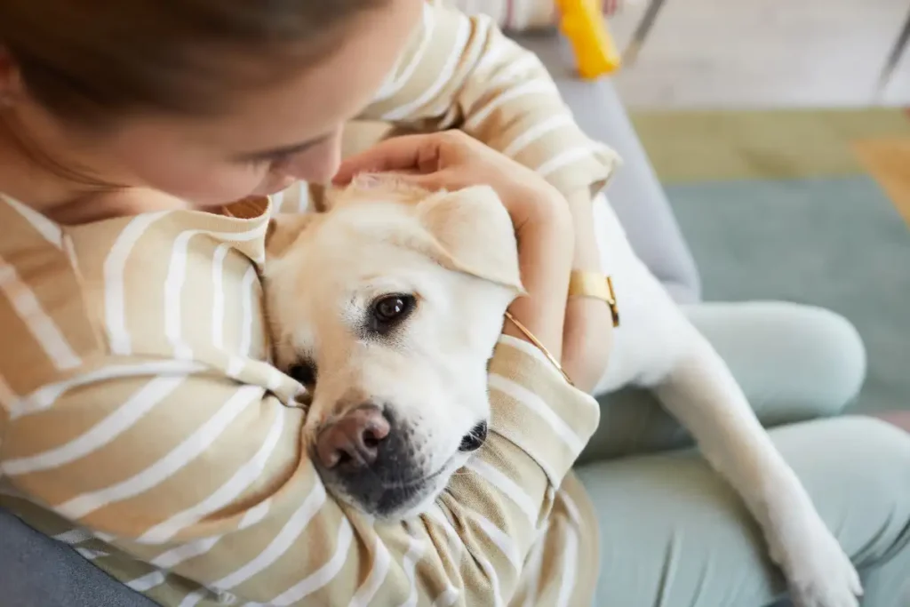 Woman Cuddling with Dog
