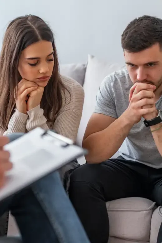 Young couple having marriage counseling in drug and alcohol treatment center