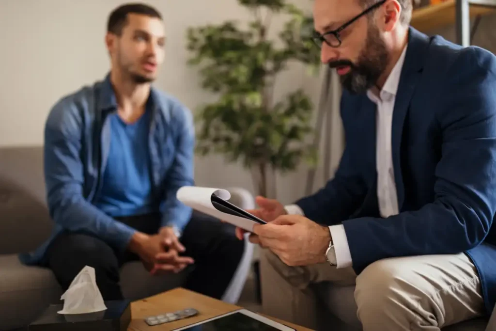 a male client together with a male psychologist during behavioral therapy