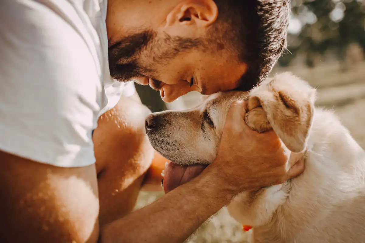 a man hugging his dog