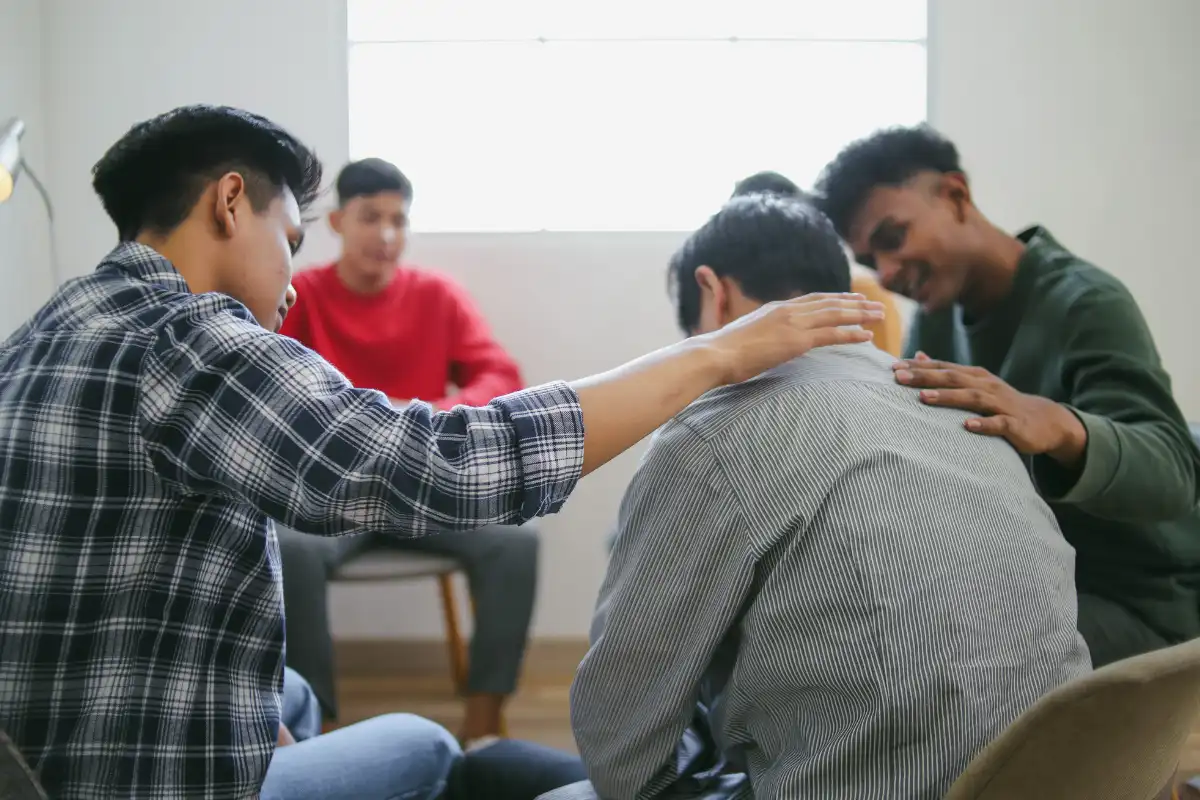 Men in group therapy session