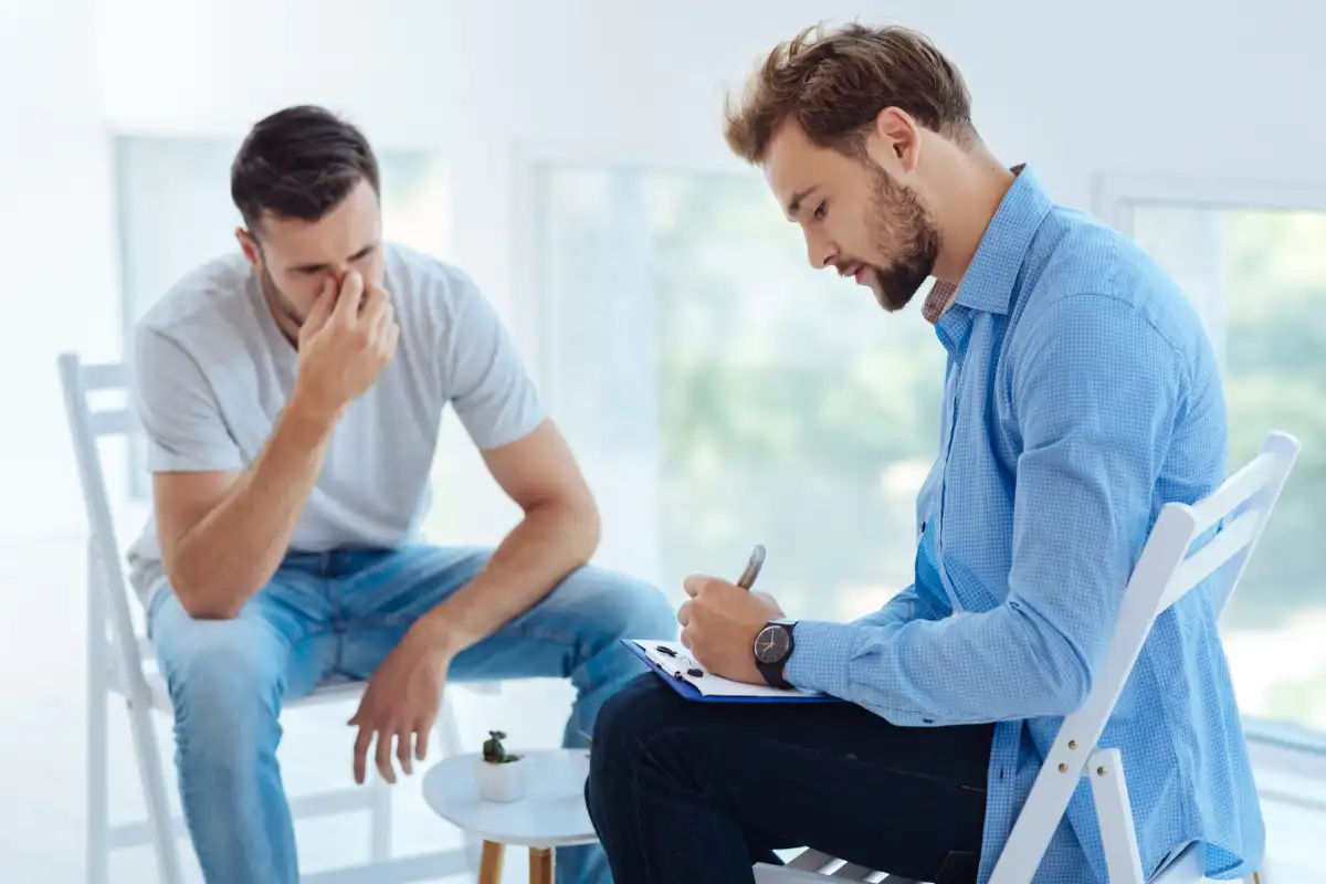 Smart handsome psychologist writing