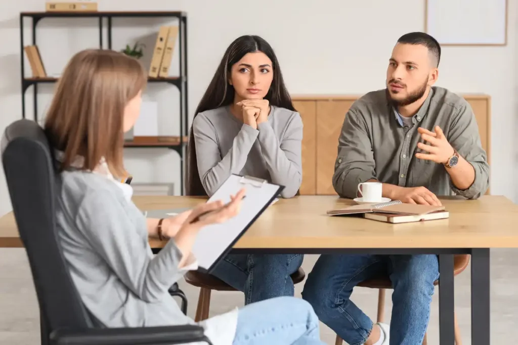 Young couple talking with Psychologist