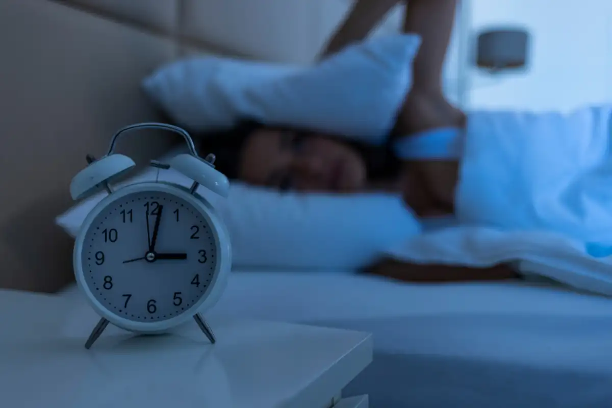 Sleepless woman suffering from insomnia, sleep apnea or stress.
