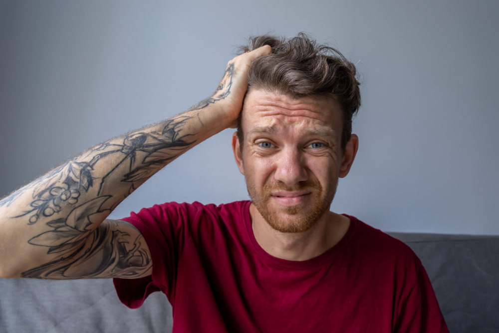 A stressed man with ADHD can not focus