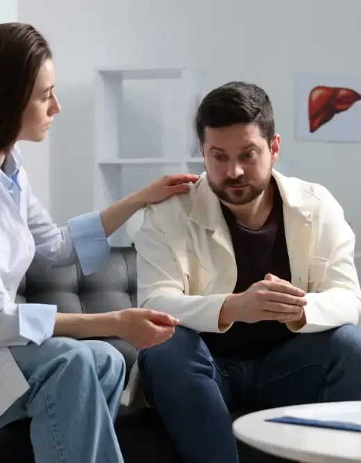 Alcoholic Man Having Appointment with Healthcare Specialist in Clinic Addiction Treatment