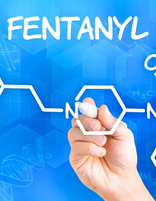 Hand with pen drawing the chemical formula of fentanyl