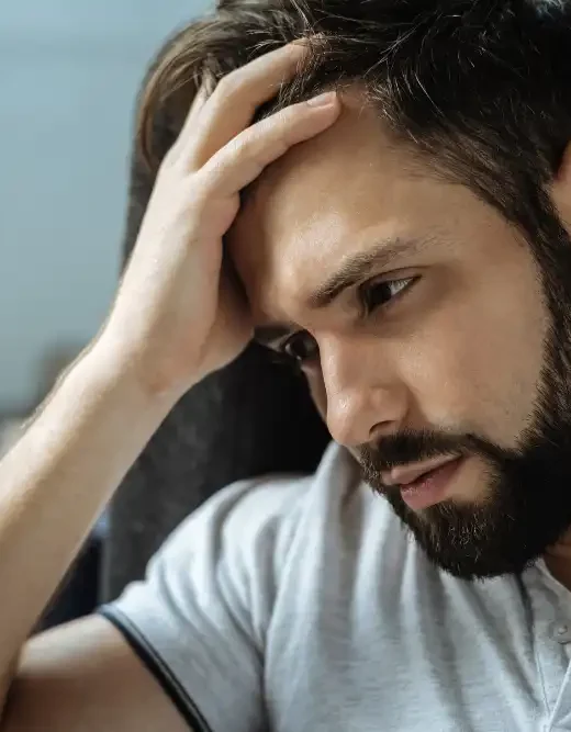 Sad bearded man feeling frustrated after a relapse