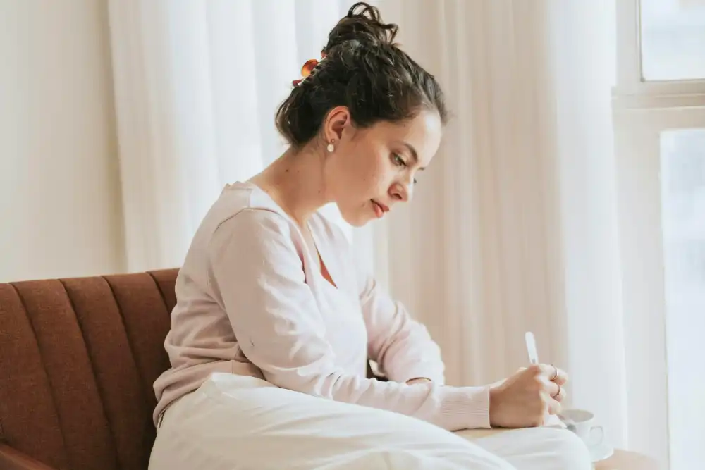 Woman Journaling in Cozy Indoor Setting