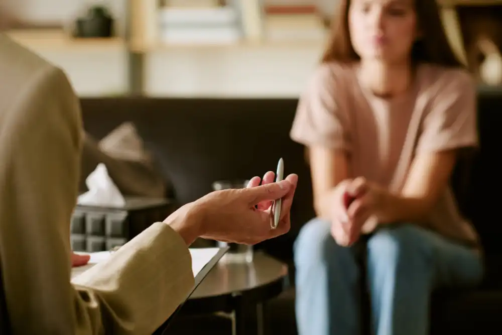 Young Woman Attending Psychological Counseling Session