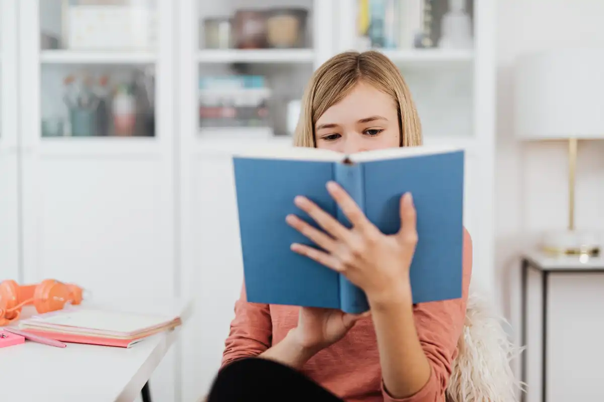 young woman reading books about recovery