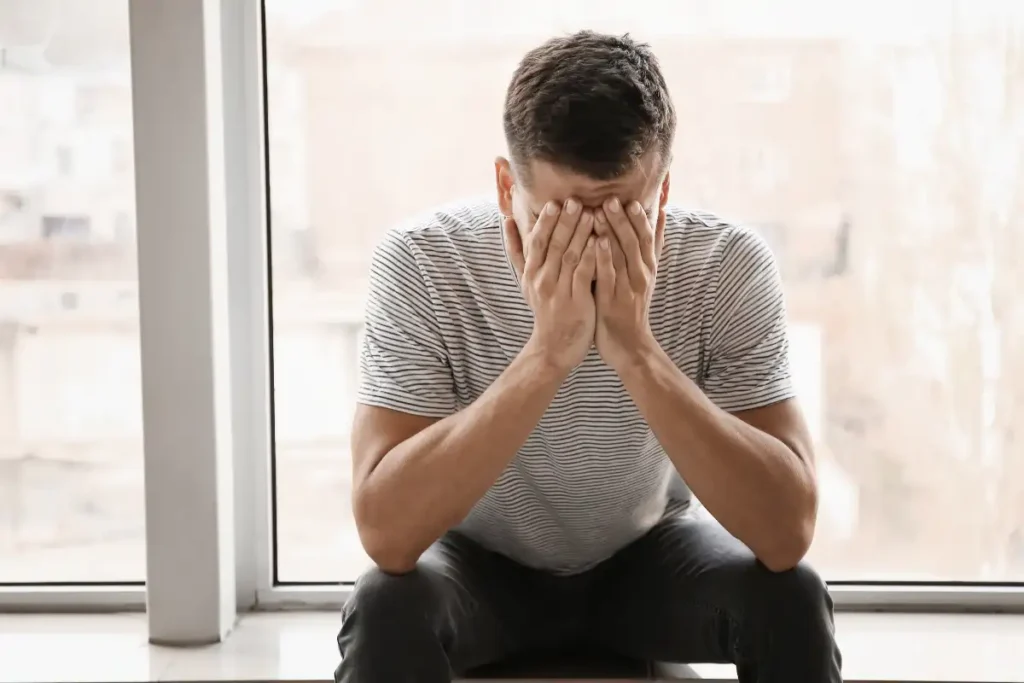 Depressed Man near the Window