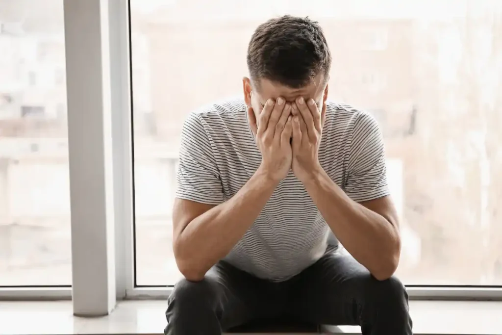 depression and substance abuse recovery sad man near the window
