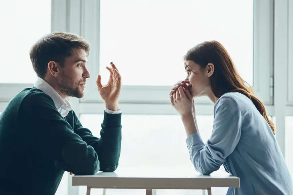 Couple in Serious Conversation at a Table