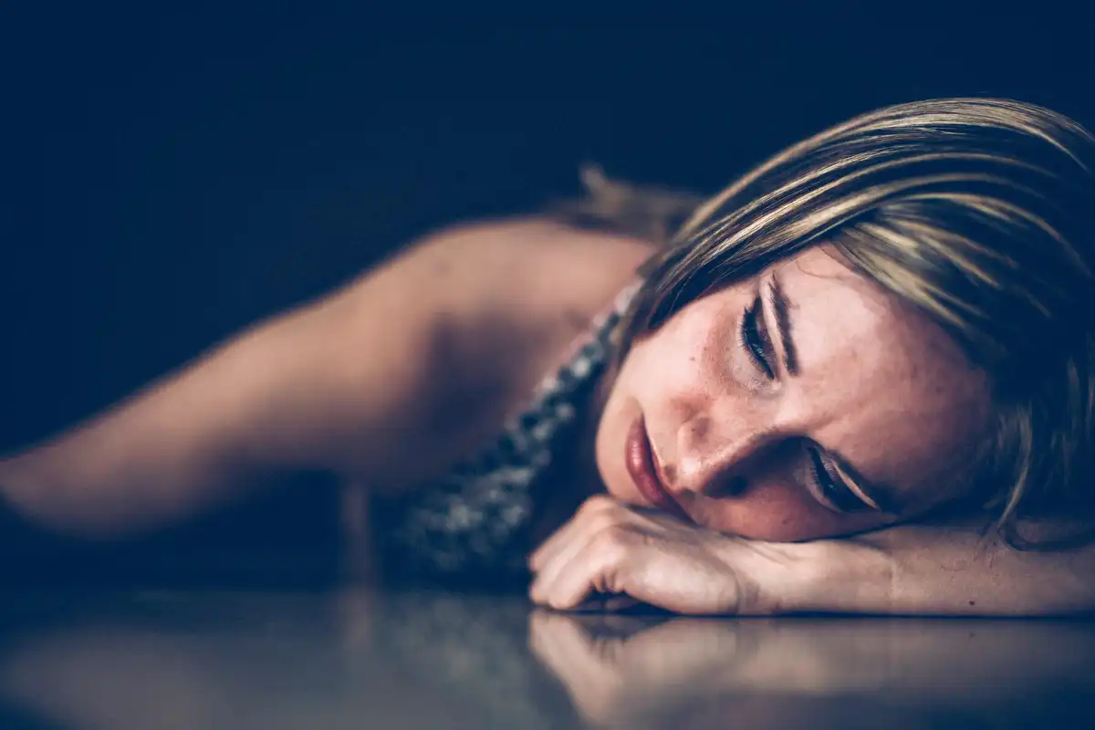 Sad woman leaning on the table